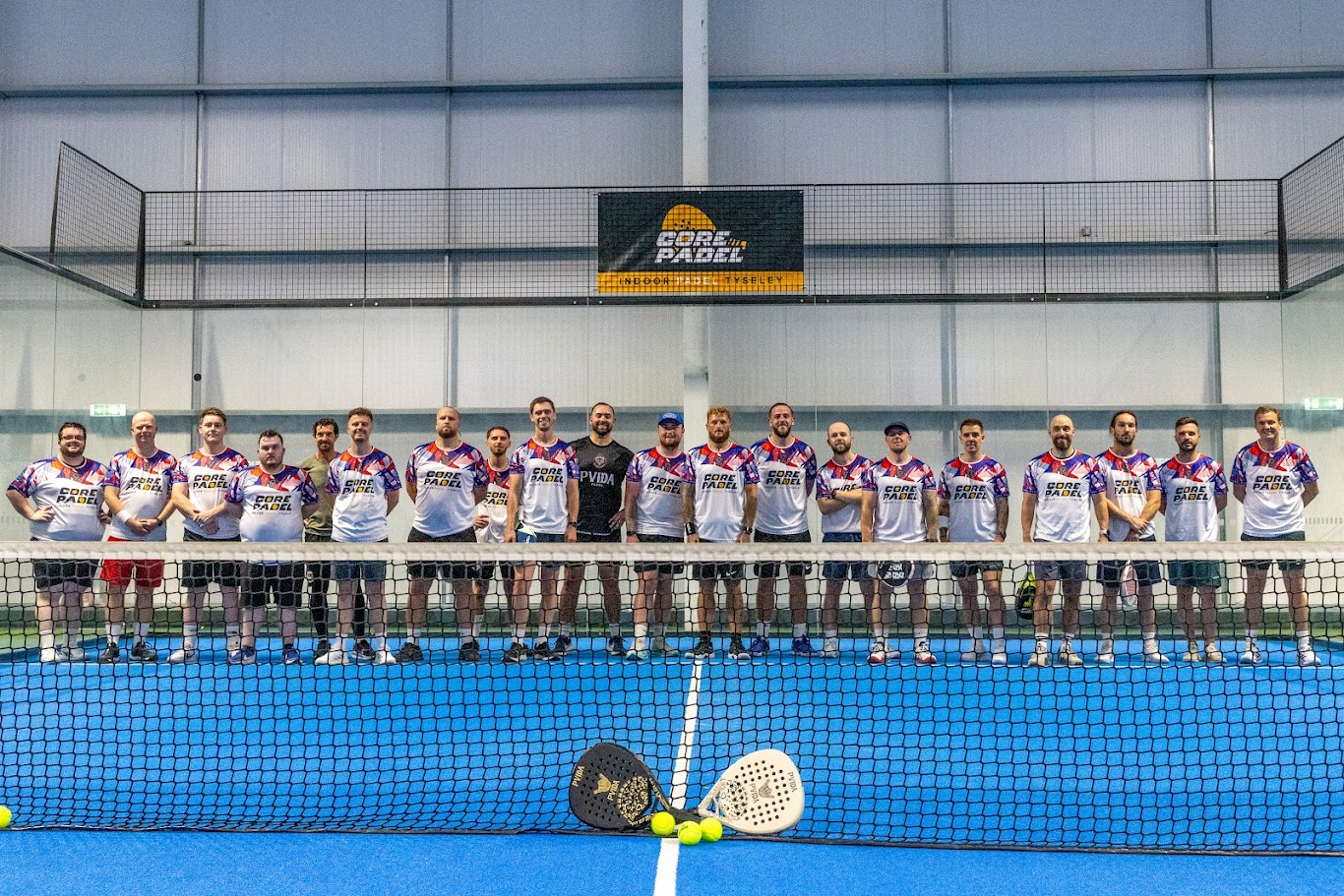 Twenty players lined up across the net before a MACA event begins